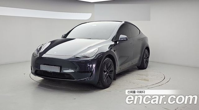 Tesla Model Y 2025 — photo 1