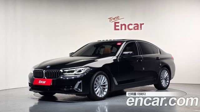 BMW 5-Series 2023 — photo 1