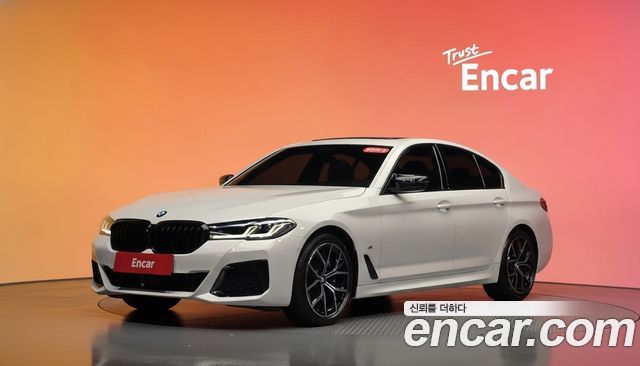 BMW 5-Series 2023 — photo 1