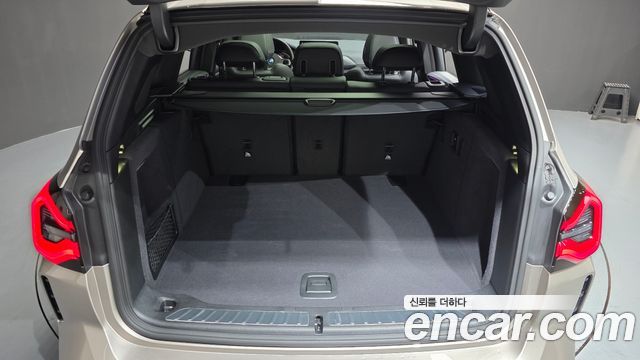 BMW iX3 2024 — photo 26