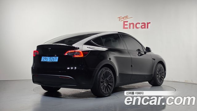Tesla Model Y 2024 — photo 2