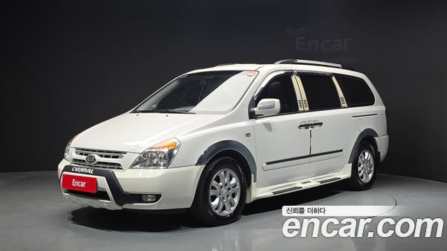 Kia Canival 2010 — photo 1