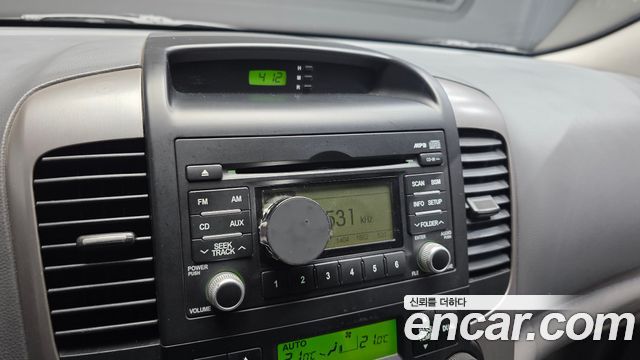Kia Canival 2010 — photo 15
