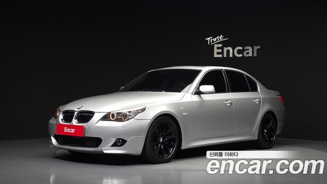 BMW 5-Series 2009 — photo 1
