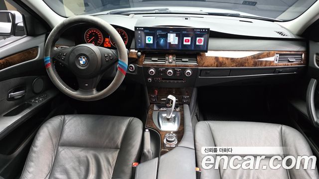 BMW 5-Series 2009 — photo 10