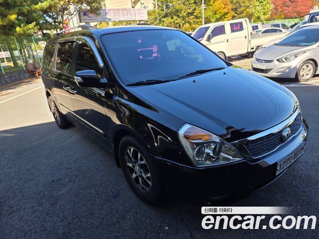 Kia Canival 2013 — photo 2
