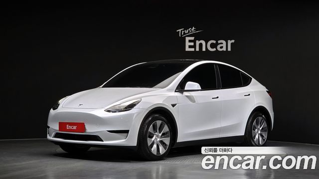Tesla Model Y 2024 — photo 1