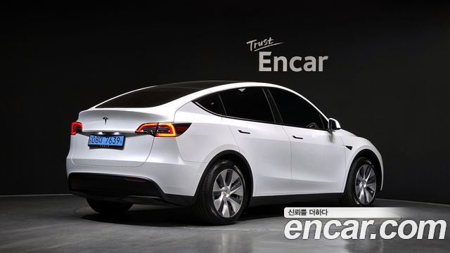Tesla Model Y 2024 — photo 2