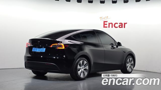 Tesla Model Y 2024 — photo 2