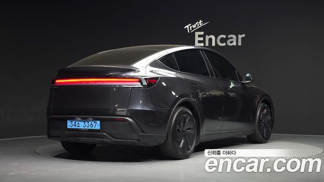 Tesla Model Y 2025 — photo 2