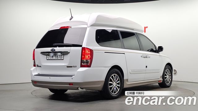 Kia Canival 2013 — photo 2