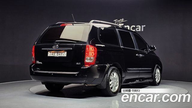 Kia Canival 2012 — photo 2