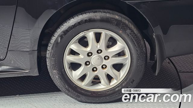 Kia Canival 2012 — photo 7