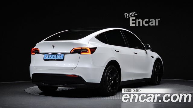 Tesla Model Y 2024 — photo 2