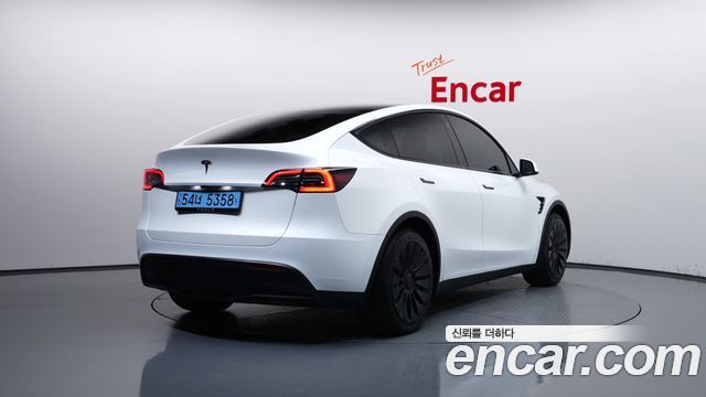 Tesla Model Y 2024 — photo 2