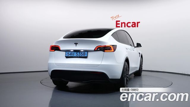 Tesla Model Y 2024 — photo 4