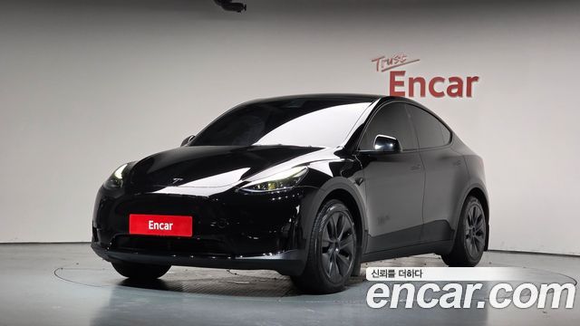 Tesla Model Y 2024 — photo 1