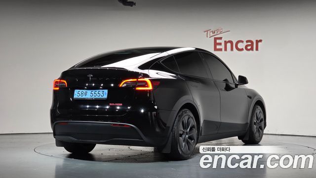 Tesla Model Y 2024 — photo 2