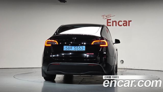Tesla Model Y 2024 — photo 4