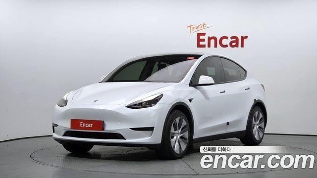 Tesla Model Y 2024 — photo 1