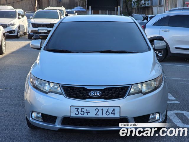 Kia Porte 2012 — photo 1