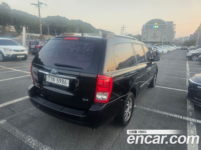 Kia Canival 2013 — photo 2