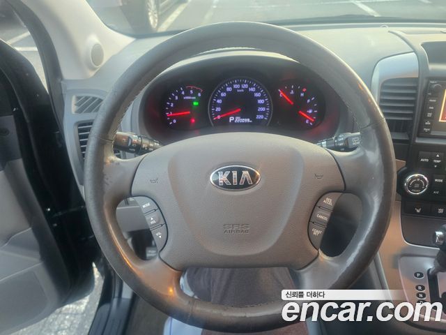 Kia Canival 2013 — photo 13