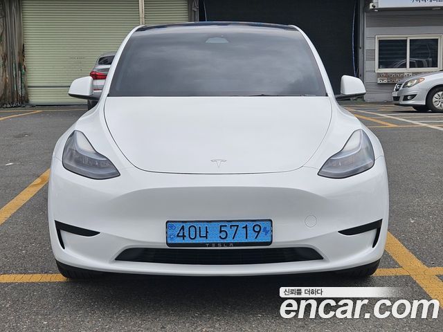 Tesla Model Y 2024 — photo 1