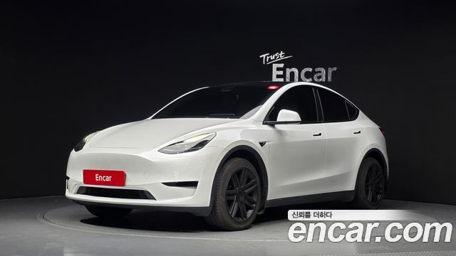 Tesla Model Y 2024 — photo 1