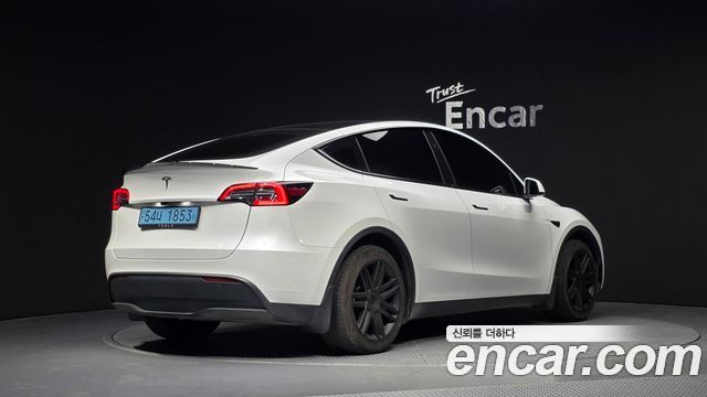 Tesla Model Y 2024 — photo 2