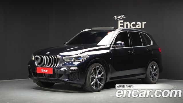 BMW X5 2021 — photo 1