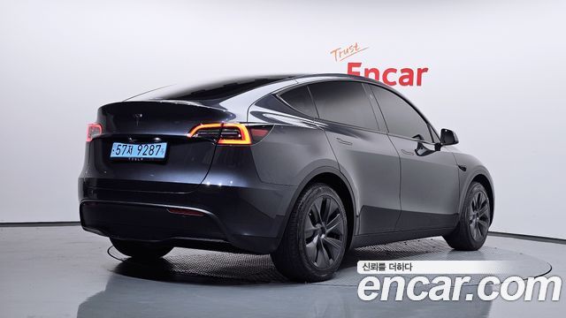 Tesla Model Y 2024 — photo 2