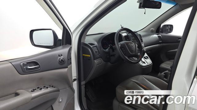 Kia Canival 2012 — photo 10