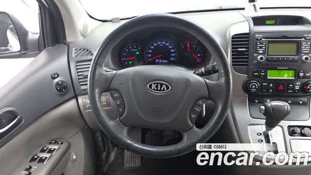 Kia Canival 2012 — photo 13
