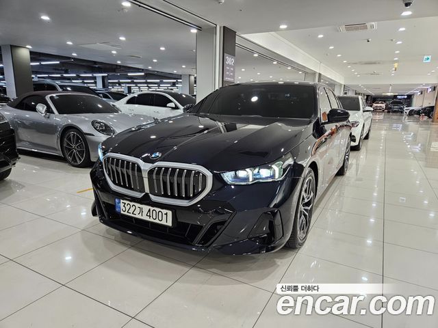 BMW 5-Series 2024 — photo 1