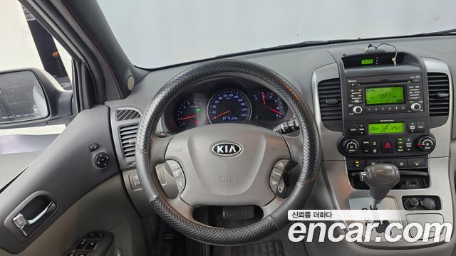 Kia Canival 2012 — photo 13