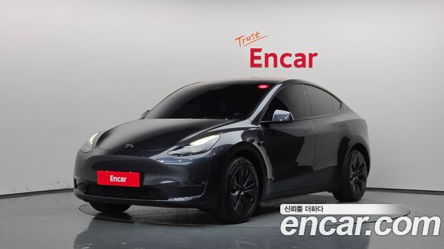 Tesla Model Y 2024 — photo 1
