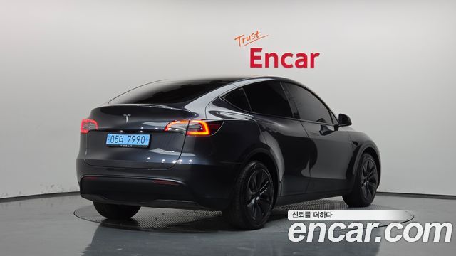 Tesla Model Y 2024 — photo 2