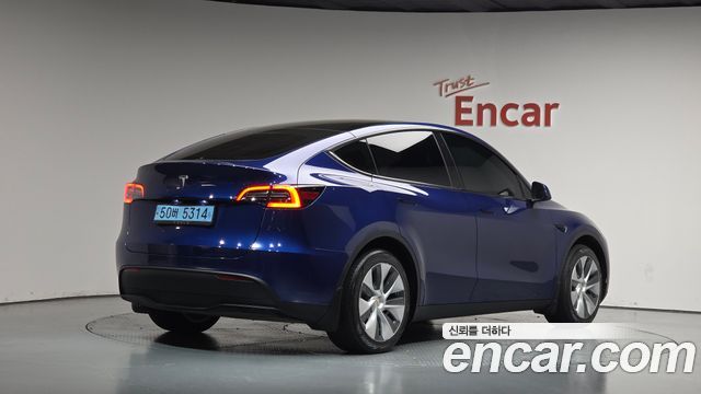 Tesla Model Y 2024 — photo 2