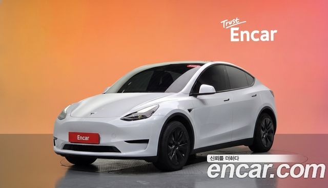 Tesla Model Y 2024 — photo 1