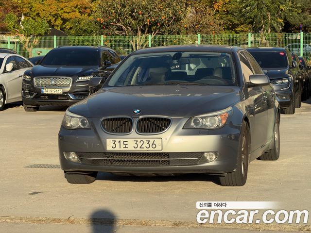 BMW 5-Series 2009 — photo 1