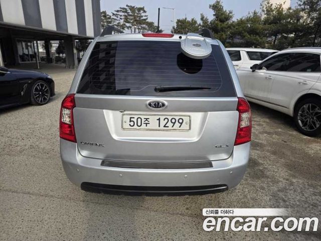 Kia Carens 2010 — photo 3