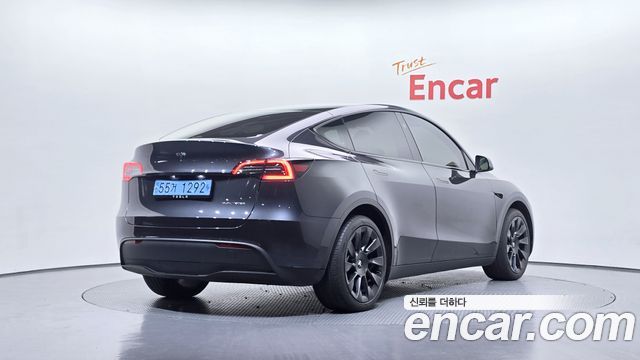 Tesla Model Y 2024 — photo 2
