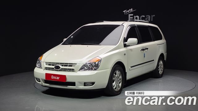 Kia Canival 2010 — photo 1