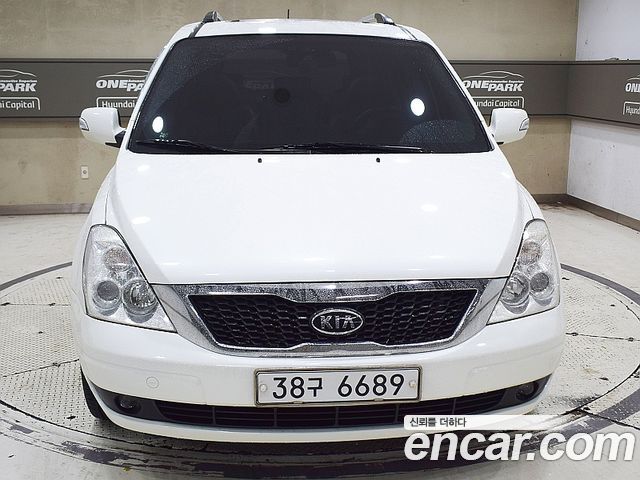 Kia Canival 2010 — photo 2