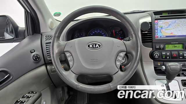Kia Canival 2012 — photo 13