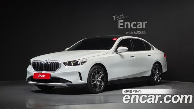 BMW 5-Series 2024 — photo 1