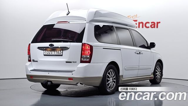 Kia Canival 2012 — photo 2