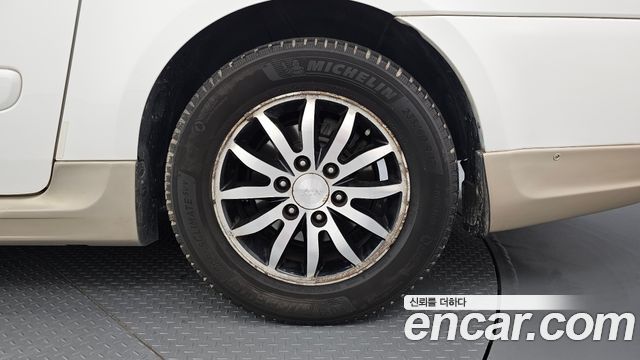 Kia Canival 2012 — photo 7