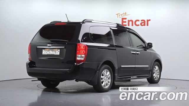 Kia Canival 2013 — photo 2
